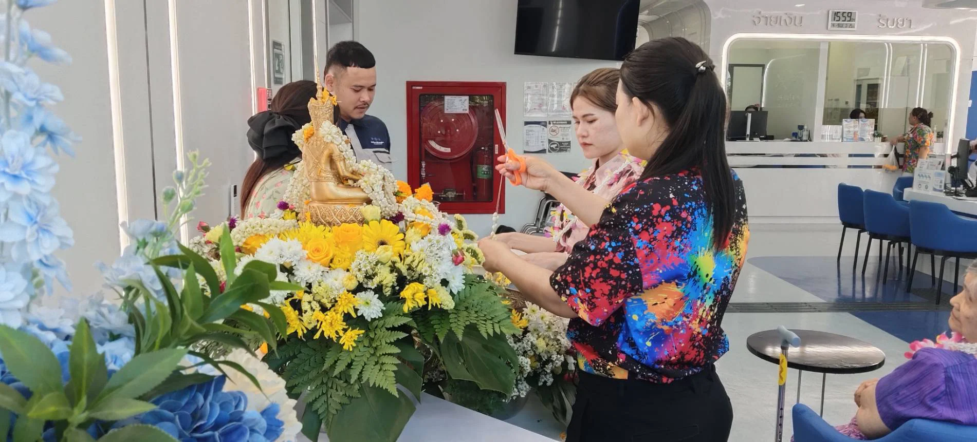 Buddha bathing and blessing ceremony at Sapiens Hospital
